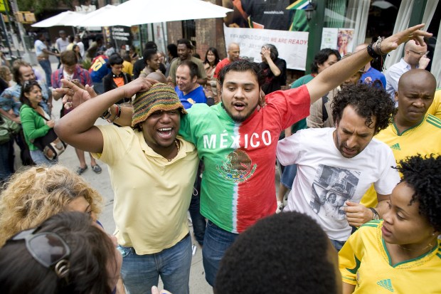Soccer fans celebrate outside Madiba, a South African restaurant in Fort Greene, Brooklyn, after watching the opening match of the 2010 World Cup between South Africa and Mexico on June 11, 2010.