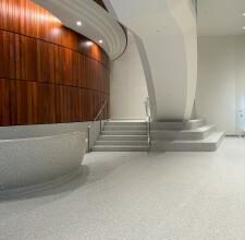 Terrazzo forming based of steps and reception desk with the floor in the lobby