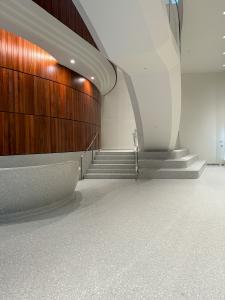 Terrazzo forming based of steps and reception desk with the floor in the lobby