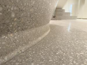 close up of the terrazzo reception desk with textured marble aggregates
