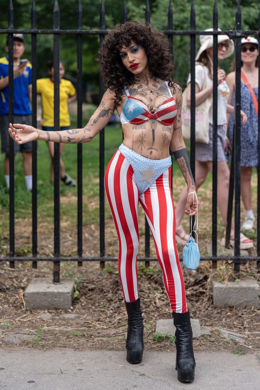 Dorian remixes the Puerto Rican flag with high-waist disco pants and a matching bedazzled bra top.