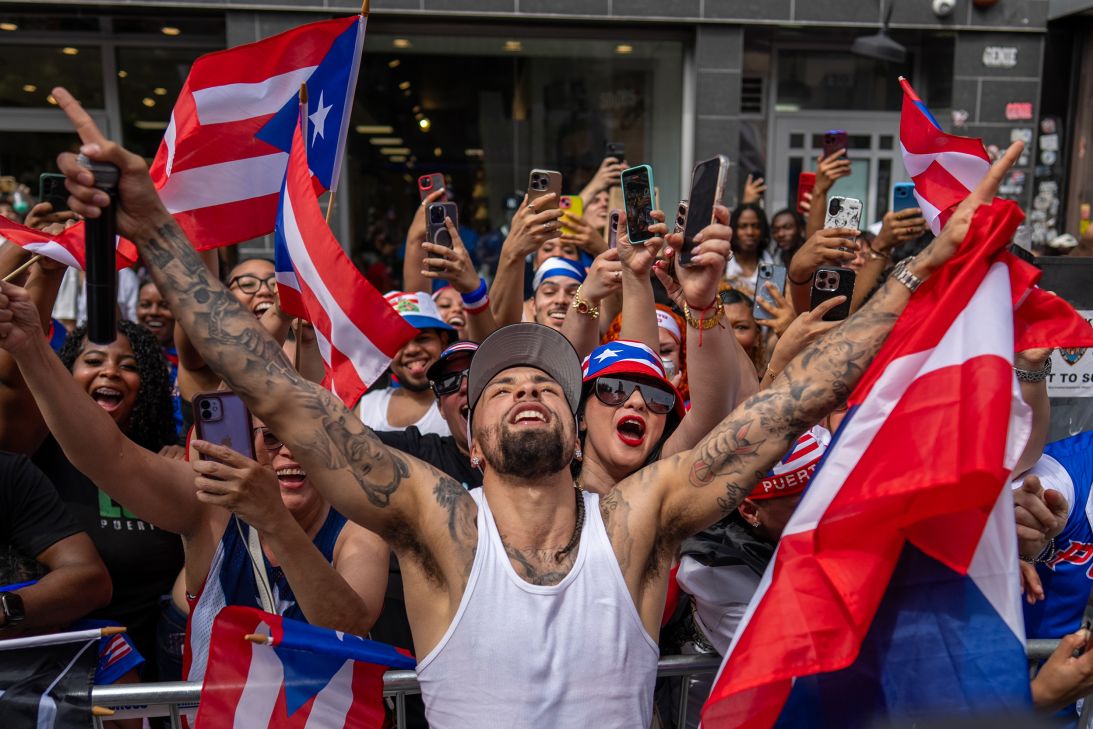 New York Knicks point guard Jose Alvarado poses with fans fresh off his NBA championship win.