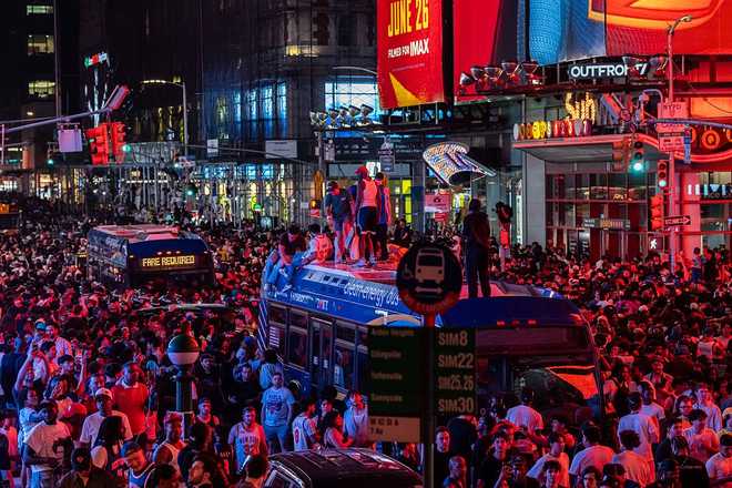 Knicks Fans Gather In NYC To Watch Game 5 Of The NBA Finals Against The San Antonio Spurs New York Knicks fans climb on buses as they celebrate after they win the NBA Finals in Times Square on June 14, 2026 in New York City.