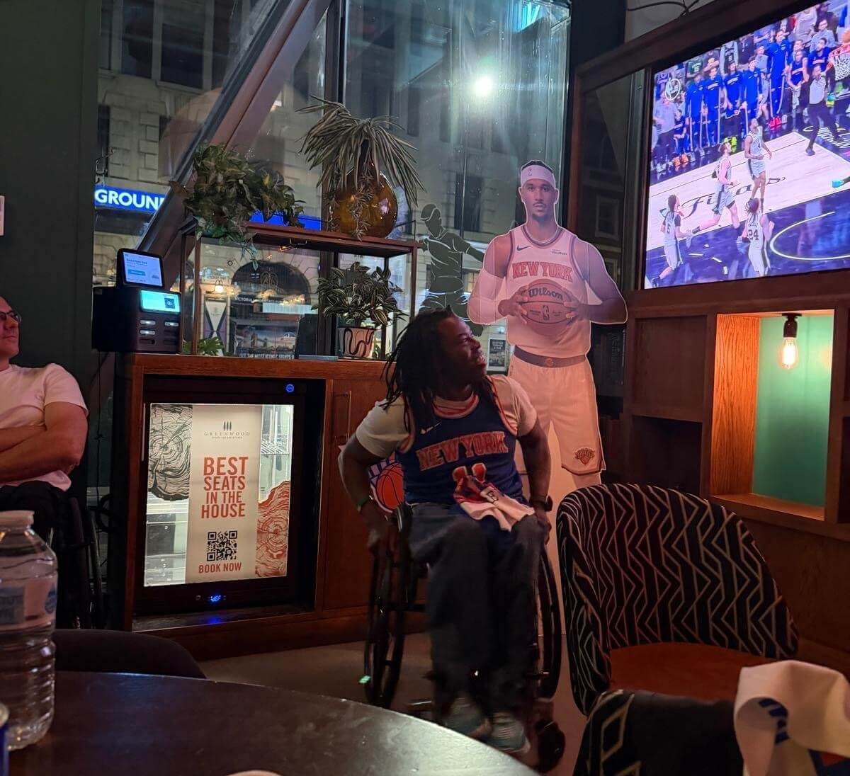 TV presenter Ade Adepitan pictured watching Game 5 of the NBA Finals in London
