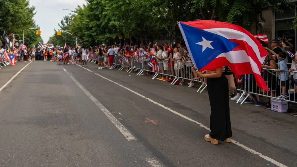 An onlooker takes in the Puerto Rican Day Parade in Bushwick, Brooklyn. - David Dee Delgado for CNN