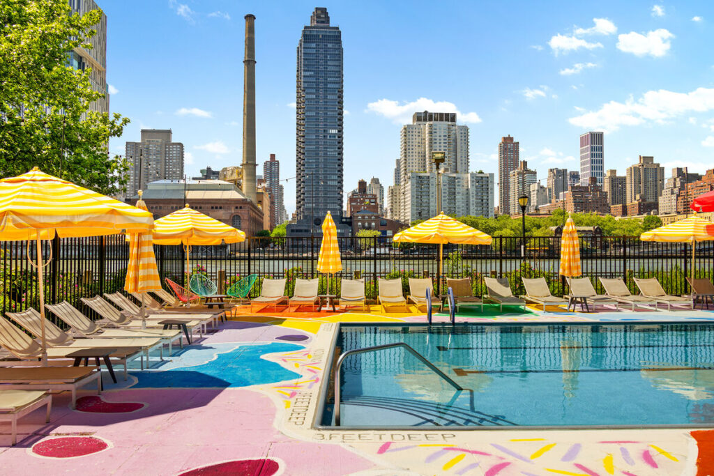 NYC’s most vibrant waterfront pool is tucked onto a hidden island — featuring 360° skyline views, lounge decks, and a massive 60-foot swim lane
