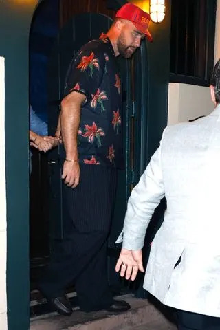 Travis Kelce leaving dinner at The Eighty SixCredit: T.JACKSON / BACKGRID
