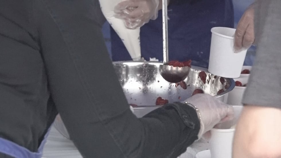 Close up of the assembly line at work making the strawberry shortcakes