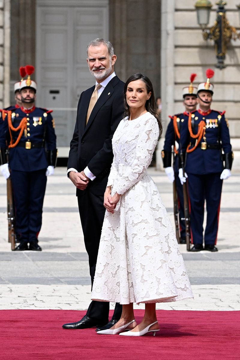 Queen Letizia completed her monochromatic ensemble with matching white accessories and understated jewelry.