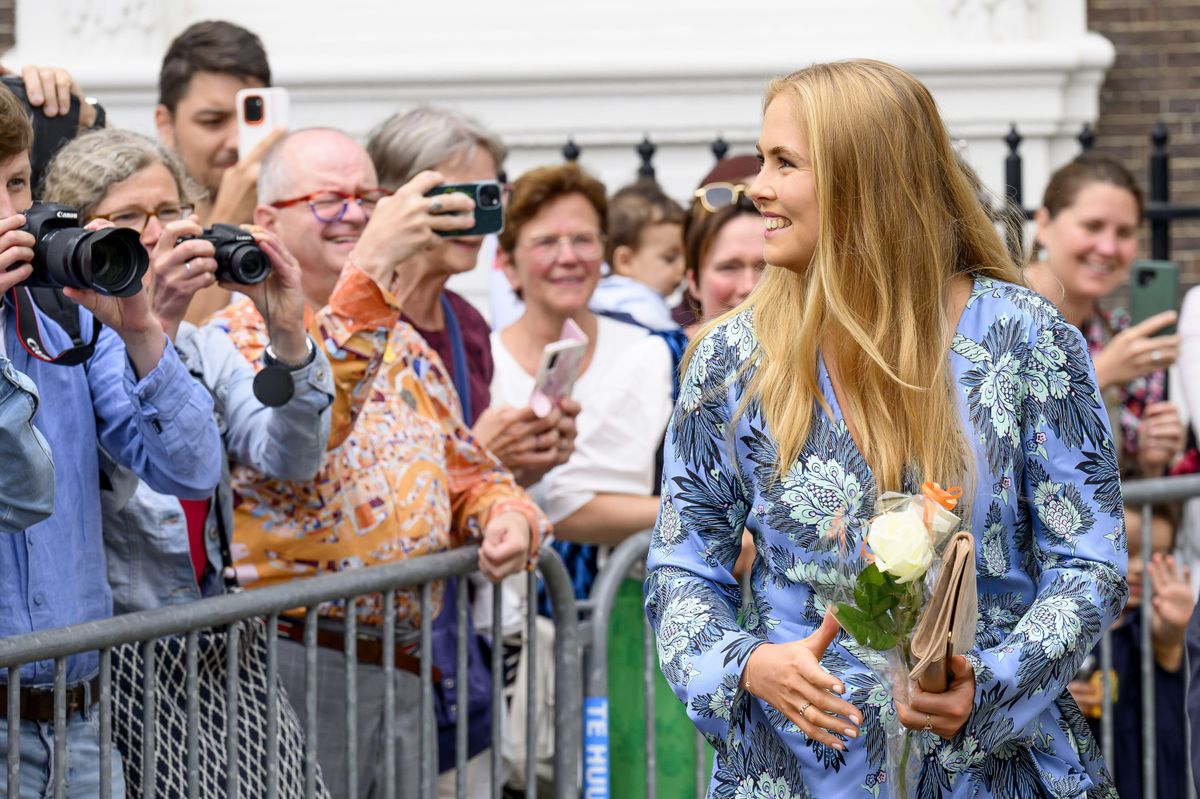 Princess Amalia rewore her blue floral Diane von Furstenberg wrap dress, styling the timeless design with nude pumps and a taupe clutch.