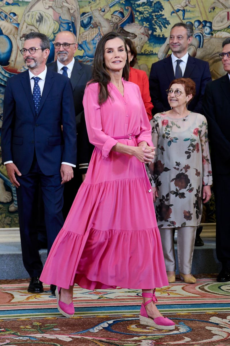 Queen Letizia revives her viral Barbiecore-inspired style with a bohemian pink dress and rope belt detail.