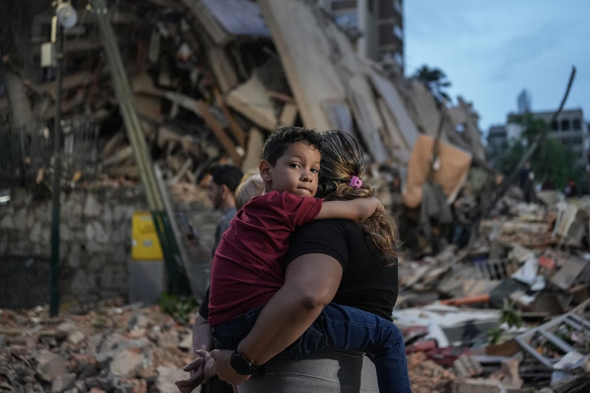 Powerful twin earthquakes have killed 32 people and injured more than 700, the nation's interim president said on June 25, after the massive shocks collapsed entire buildings and sent people running in panic. 