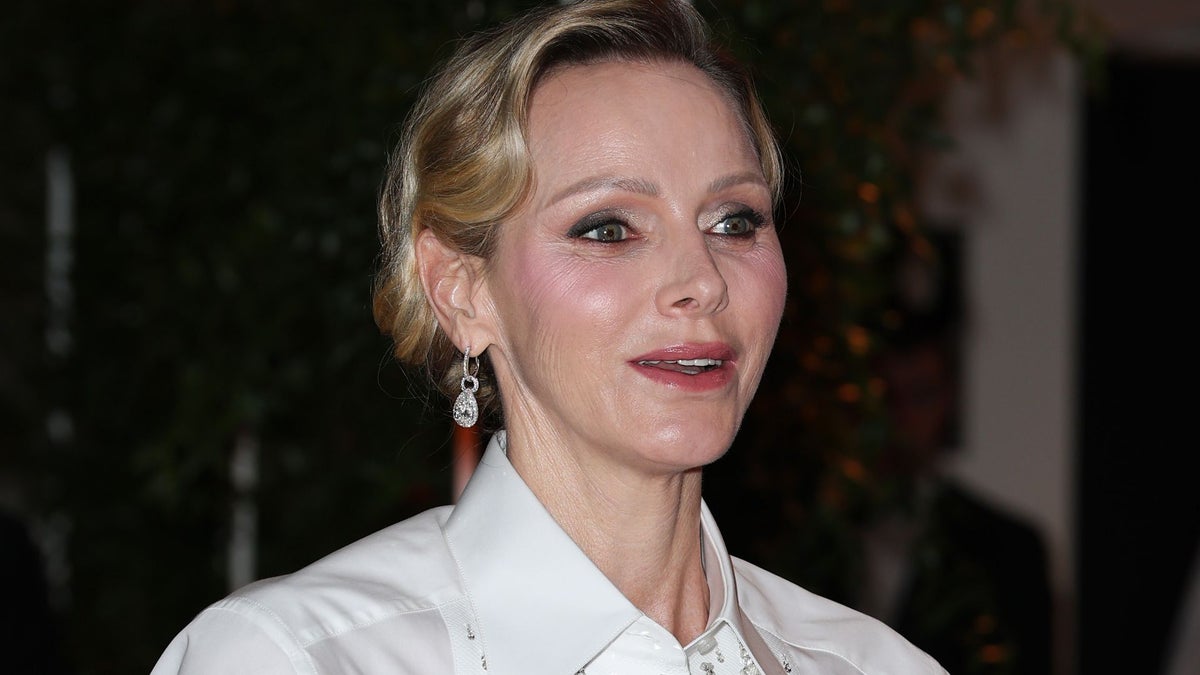 Princess Charlene revives Queen Rania’s iconic white shirt and long skirt look at Formula 1 gala