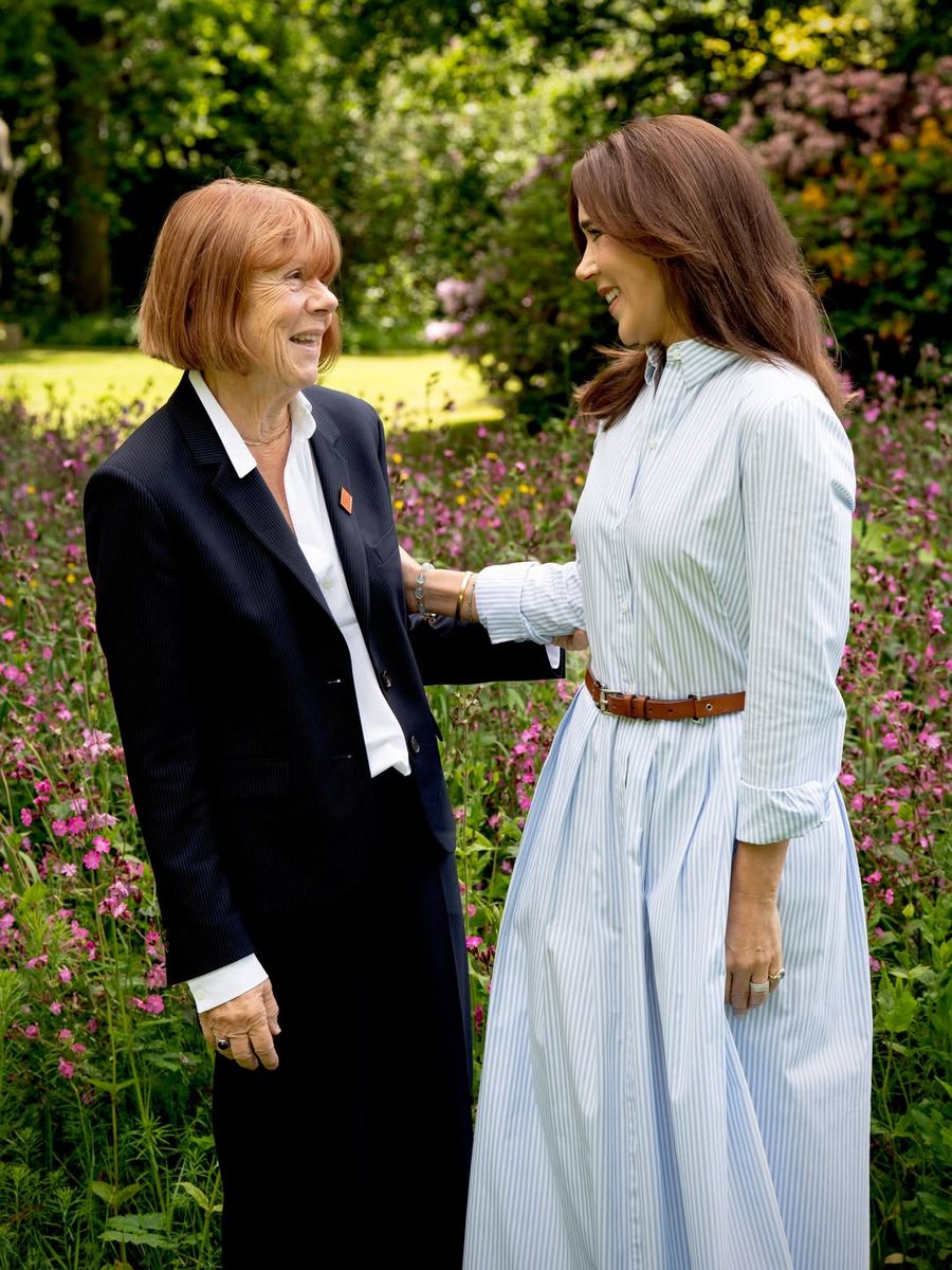 The Danish royal embraced one of summer's most timeless trends, opting for a belted shirtdress with a flattering midi silhouette.