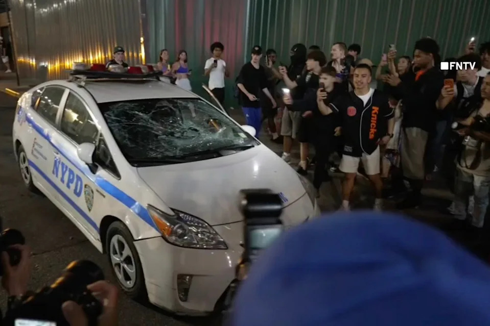 A NYPD cop car windshield was smashed during the mayhem Saturday night. FNTV