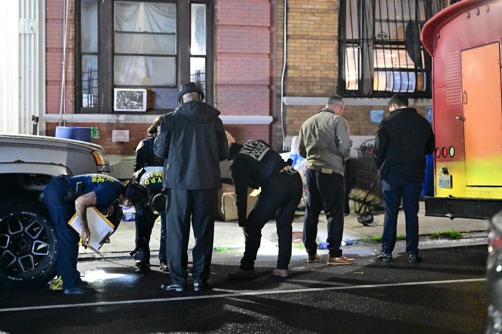 NYPD Crime Scene Unit officers and detectives investigating a fatal shooting.