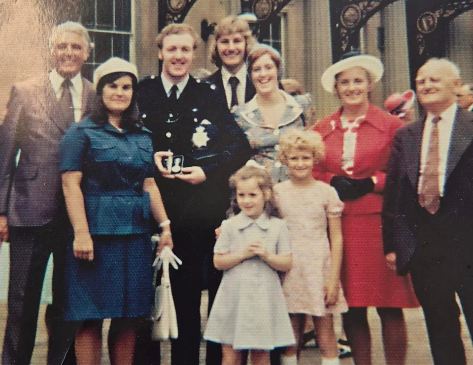 PC David surrounded by family after the award of his QGM