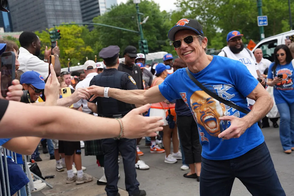 Ben Stiller shakes hands with fans as he arrives at the parade.