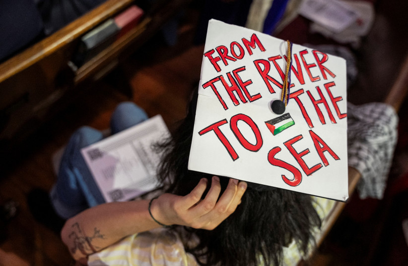 A student puts on their pro-Palestine graduation cap reading ''From the river to the sea'' at the People's Graduation, hosted for Mahmoud Khalil and other students unable to participate in Columbia and New York University's commencement ceremony, May 18, 2025.