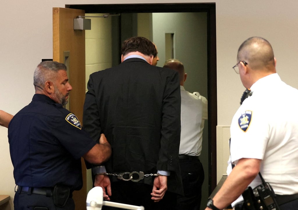 Rex Heuermann is escorted away after being sentenced at Suffolk County Court in Riverhead, New York, on Wednesday. Photo: Reuters