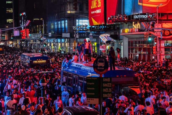 New York Knicks celebrate in Times Square on Saturday. (Photo by Adam Gray/Getty Images)