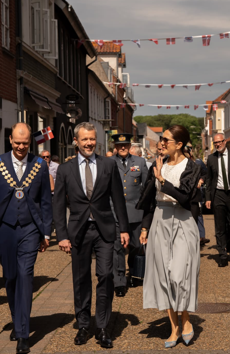 The royal's scarf-wrapped bun proved both practical and elegant as she greeted well-wishers during the 2026 Royal Summer Cruise.