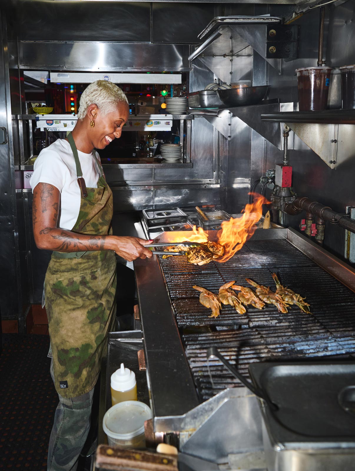Chef Williams preparing the famous jerk chicken at Miss Lily's. © Michael Condran