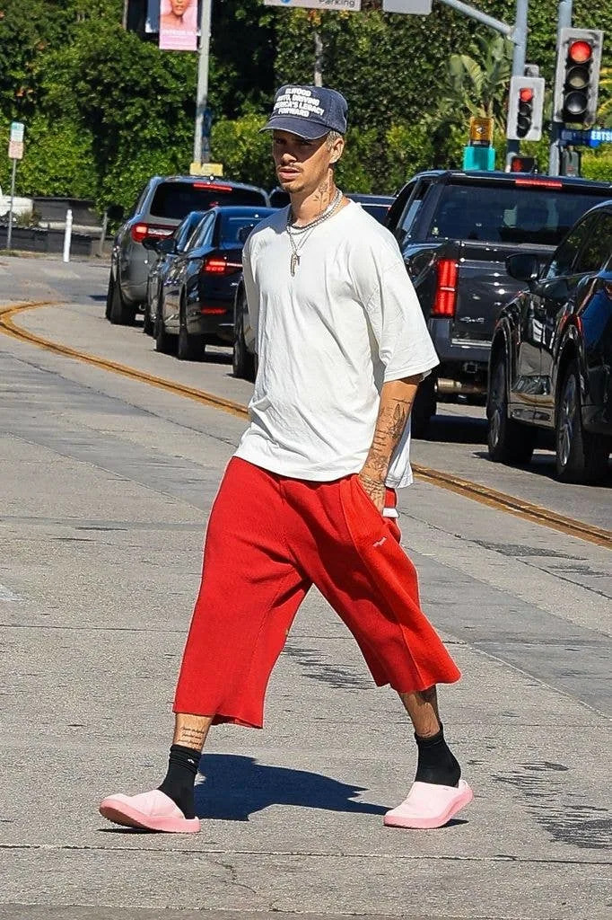 Romeo Beckham with his hands in his pockets