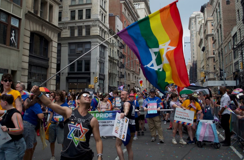 Dillon Perez waves a Jewish pride flag at the New York City Pride March on June 29, 2026.