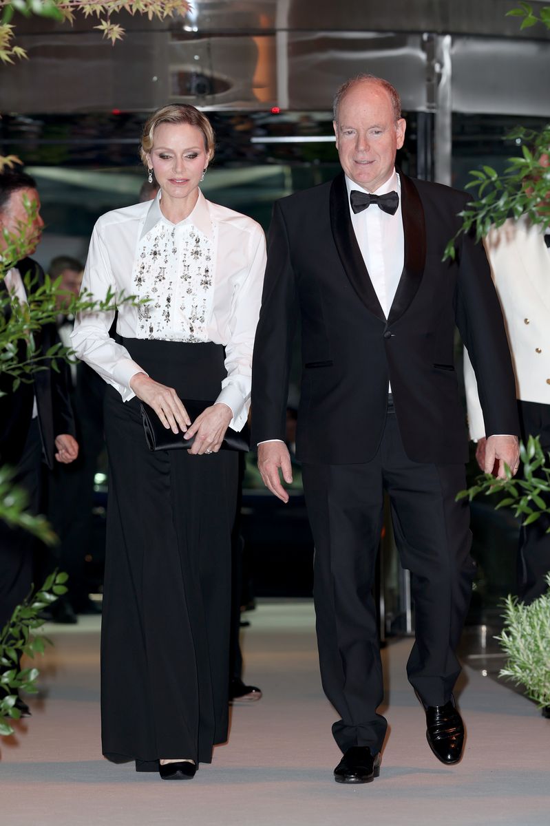 Princess Charlene arrives at the Monaco Grand Prix gala in a striking black-and-white ensemble centered around an embellished white shirt.