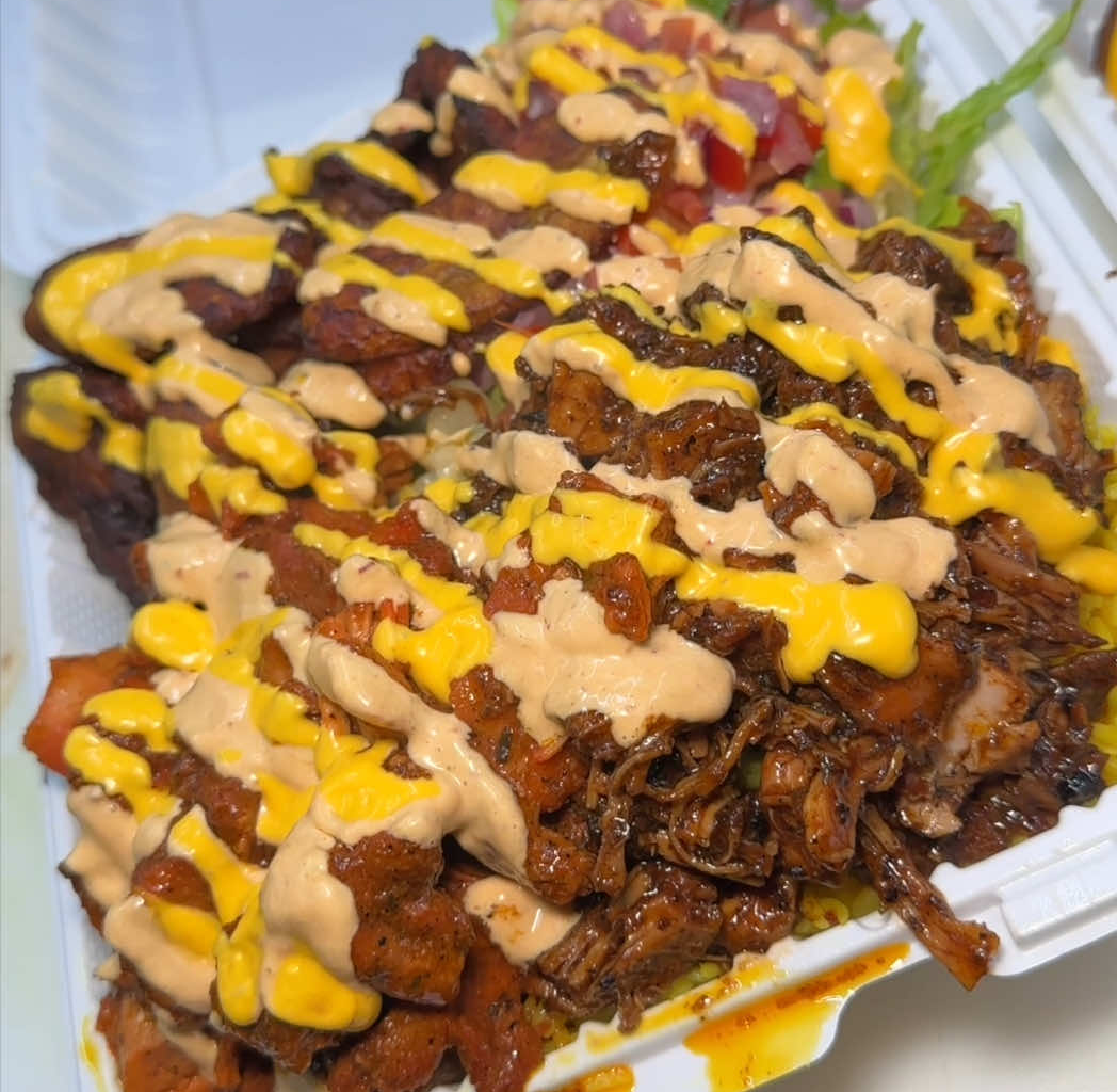 This Massive NYC Halal Platter Is Piled So High It Defies Gravity