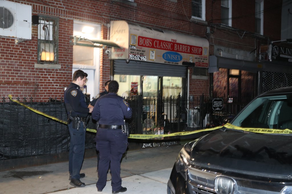 A violent clash broke out inside the small storefront barber shop, sources said.