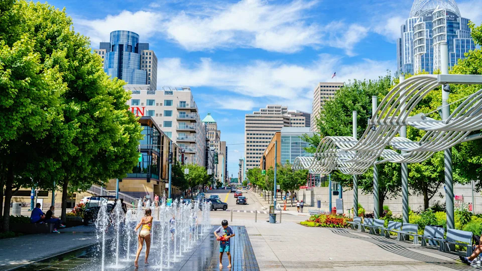 Children playing in the fountain at the Smale Riverfront Park with downtown Cincinnati in the backdrop