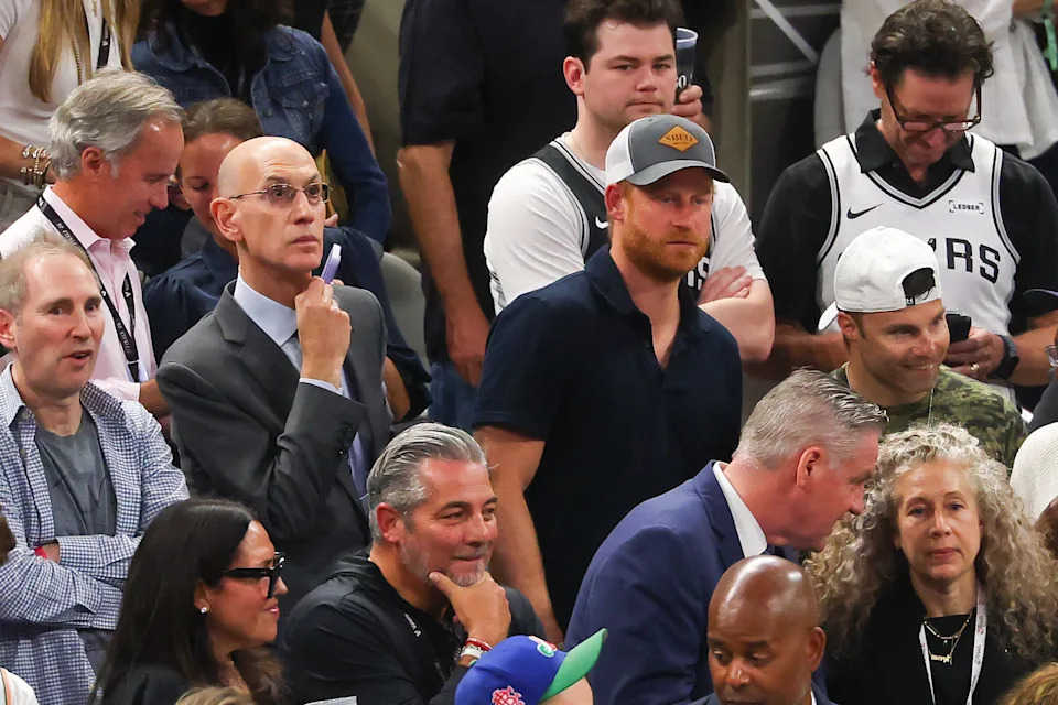 NBA Commissioner Adam Silver and Prince Harry look on.