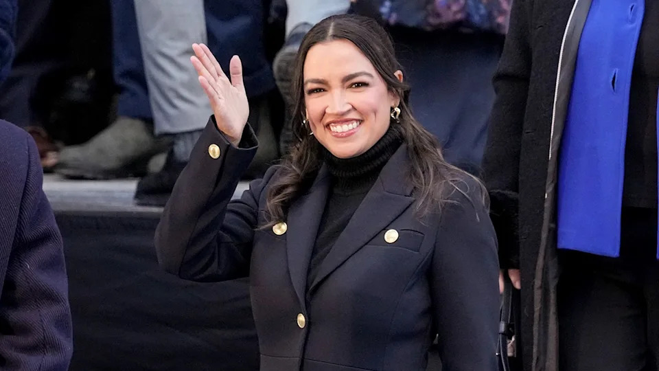 Rep. Alexandria Ocasio-Cortez waving to crowd at City Hall in New York City