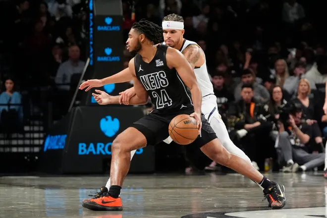 Oct 29, 2024; Brooklyn, New York, USA; Brooklyn Nets small guard Cam Thomas (24) dribbles the ball against Denver Nuggets small forward Michael Porter Jr. (1) during the first half at Barclays Center. Mandatory Credit: Gregory Fisher-Imagn Images