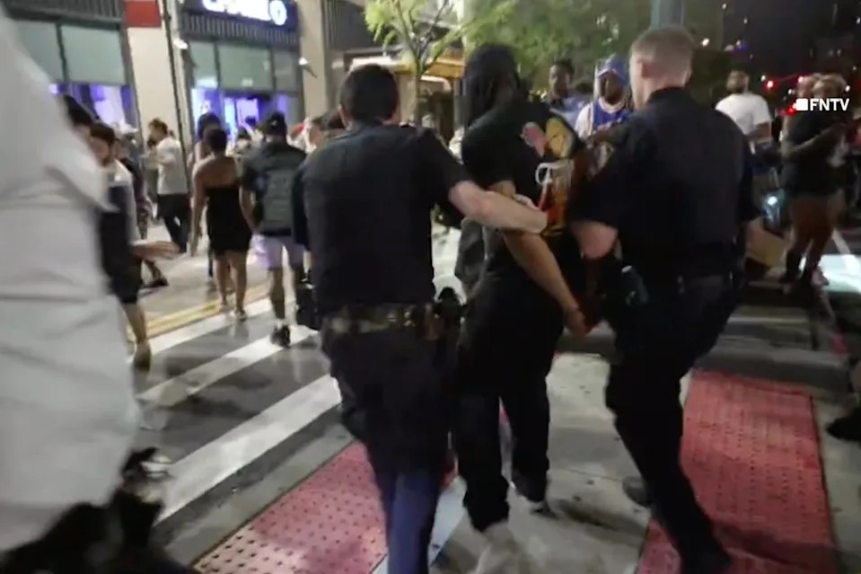 One person is seen taken away by NYPD in the video. FNTV