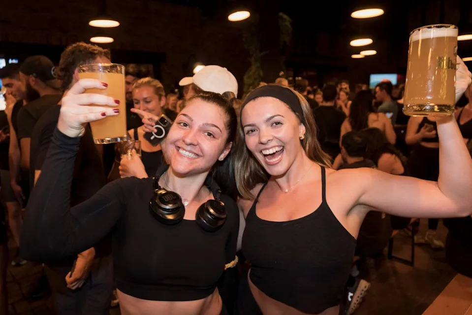 Runners of Lunge Run Club grabbing a beer after a 3-mile run Stefano Giovannini