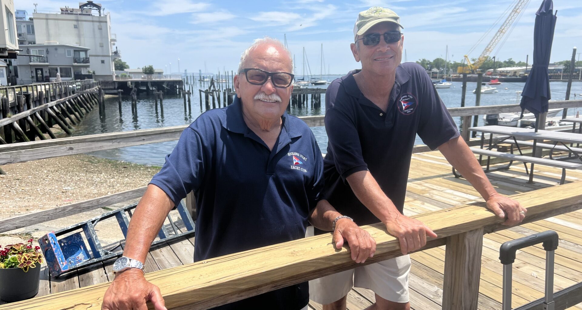 Rockaway Point Yacht Club Fleet Captain Ben Paolino, left, alongside member and cannoneer Glenn Pfister. Photo: Wayne Daren Schneiderman/Brooklyn Eagle