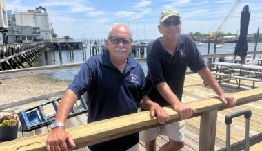 Rockaway Point Yacht Club Fleet Captain Ben Paolino, left, alongside member and cannoneer Glenn Pfister. Photo: Wayne Daren Schneiderman/Brooklyn Eagle