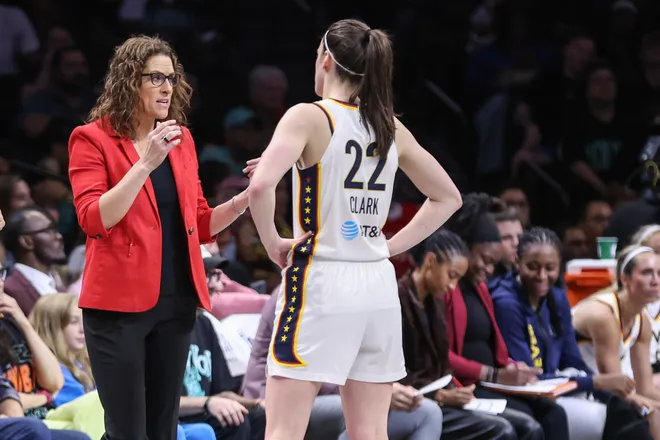Jun 6, 2026; Brooklyn, New York, USA; Indiana Fever head coach Stephanie White talks with guard Caitlin Clark (22) in the second quarter against the New York Liberty at Barclays Center. Mandatory Credit: Wendell Cruz-Imagn Images