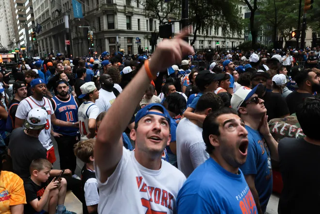 NEW YORK, NEW YORK - JUNE 18: Fans line up ahead of the New York Knicks Championship ticker tape parade and victory rally celebrating winning the 2026 NBA Finals on June 18, 2026 in New York City. The New York Knicks defeated the San Antonio Spurs in five games to win their first NBA Championship in 53 years.