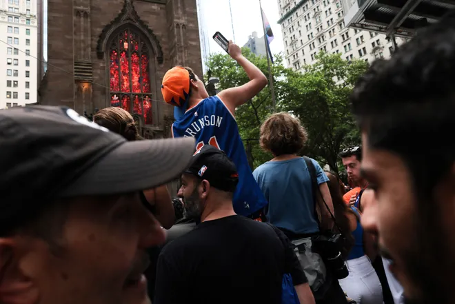 NEW YORK, NEW YORK - JUNE 18: Fans line up ahead of the New York Knicks Championship ticker tape parade and victory rally celebrating winning the 2026 NBA Finals on June 18, 2026 in New York City. The New York Knicks defeated the San Antonio Spurs in five games to win their first NBA Championship in 53 years.