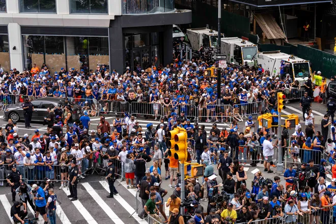 NEW YORK, NEW YORK - JUNE 18: Thousands of fans gather in lower Manhattan for the New York Knicks Championship ticker tape parade and victory rally celebrating winning the 2026 NBA Finals on June 18, 2026 in New York City. The New York Knicks defeated the San Antonio Spurs in five games to win their first NBA Championship in 53 years.