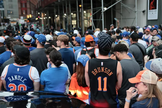 NEW YORK, NEW YORK - JUNE 18: Fans line up ahead of the New York Knicks Championship ticker tape parade and victory rally celebrating winning the 2026 NBA Finals on June 18, 2026 in New York City. The New York Knicks defeated the San Antonio Spurs in five games to win their first NBA Championship in 53 years.
