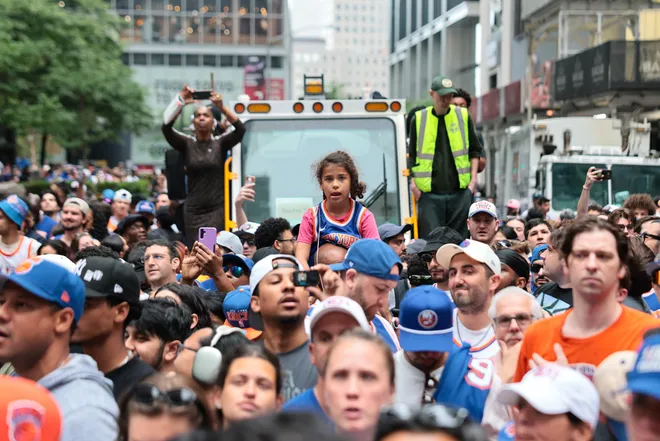 NEW YORK, NEW YORK - JUNE 18: Fans arrive ahead of the New York Knicks Championship ticker tape parade and victory rally celebrating winning the 2026 NBA Finals on June 18, 2026 in New York City. The New York Knicks defeated the San Antonio Spurs in five games to win their first NBA Championship in 53 years.