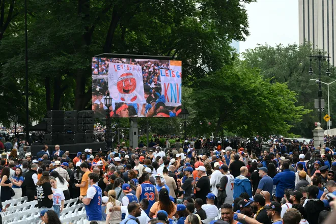 People attend a championship ticker-tape parade celebrating the New York Knicks' NBA Finals victory in New York on June 18, 2026.