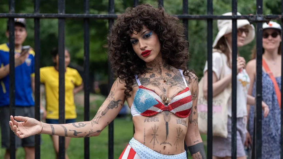 Dorian remixes the Puerto Rican flag with high-waist disco pants and a matching bedazzled bra top. - David Dee Delgado for CNN