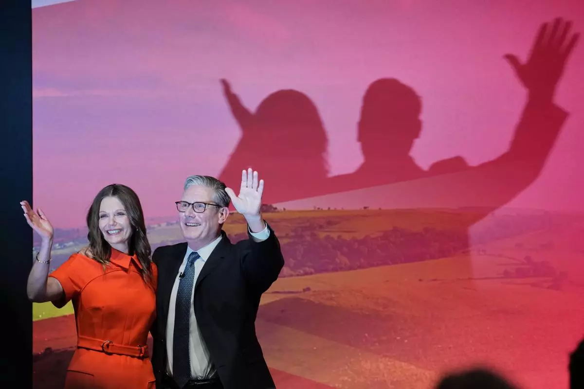 FILE - Britain's Prime Minister Keir Starmer and his wife Victoria wave to the delegates and audience after he gave his keynote speech at the annual Labour Party conference in Liverpool, England, Tuesday, Sept. 30, 2025. (AP Photo/Jon Super, File)