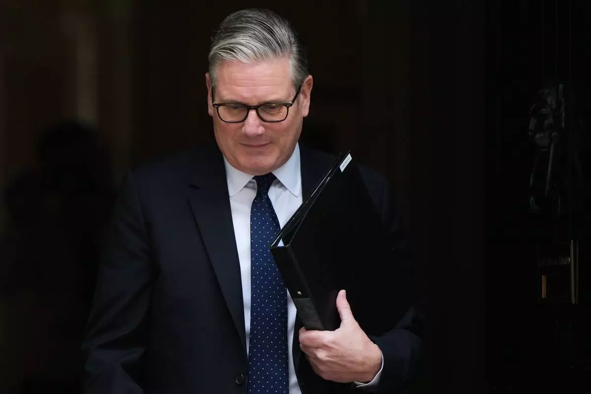FILE - Britain's Prime Minister Keir Starmer leaves 10 Downing Street in London, Monday, April 20, 2026 to face a showdown in Parliament over the appointment of Peter Mandelson as ambassador to Washington. (AP Photo/Alastair Grant, File)